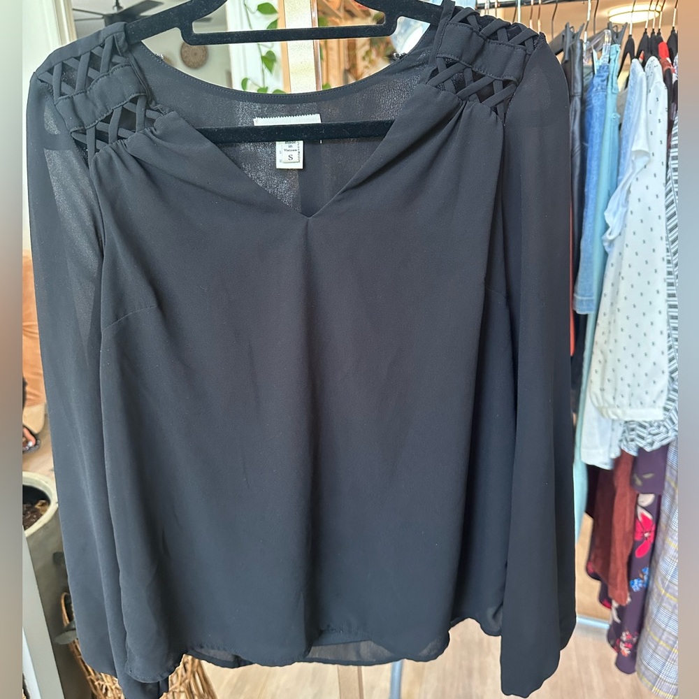 Black long sleeved blouse with unlined sleeves. Size Small